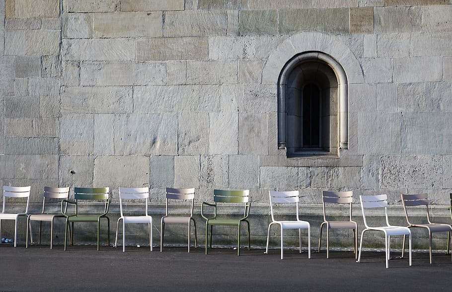 empty, row, metal armless chairs, side, gray, wall, daytime, Church, Zurich, Switzerland