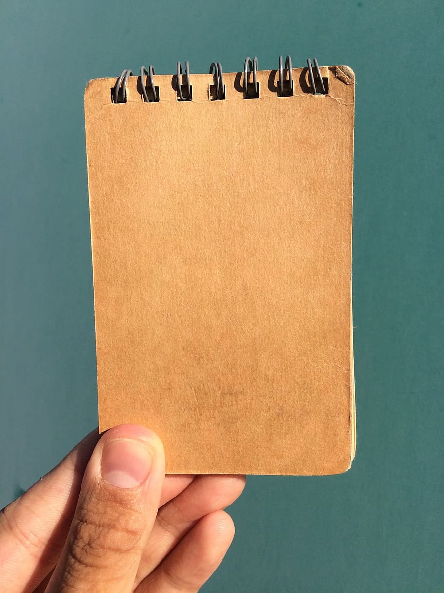 brown spring notebook, brown, spring, notebook, left hand, on the cover, male, hand, flesh color, skin