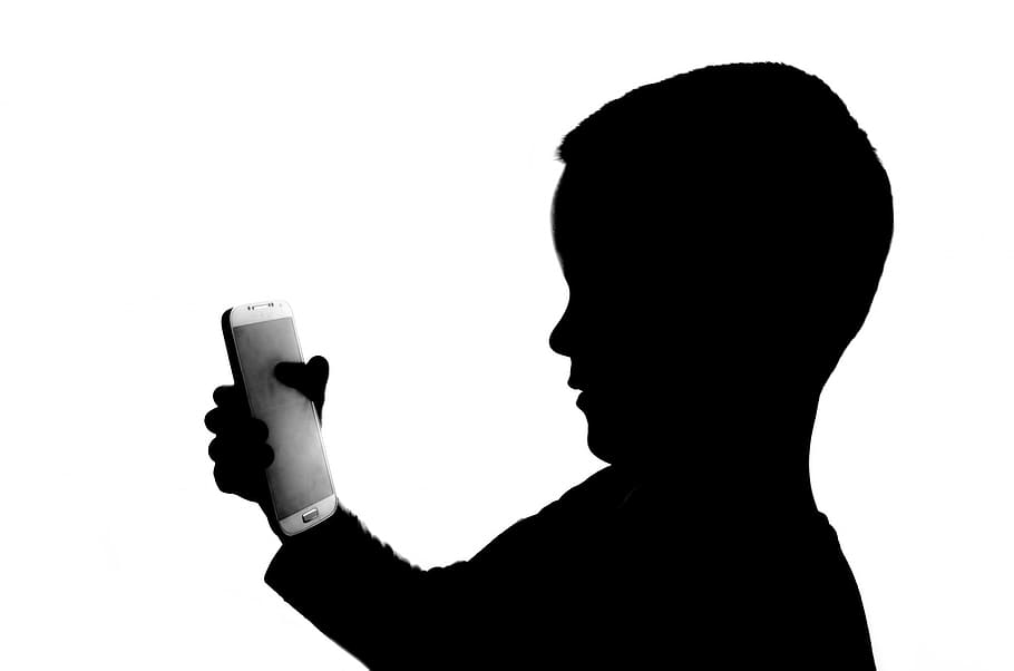 boy holding smartphone, people, white, phone, holding, kid, player, side view, profile, isolated