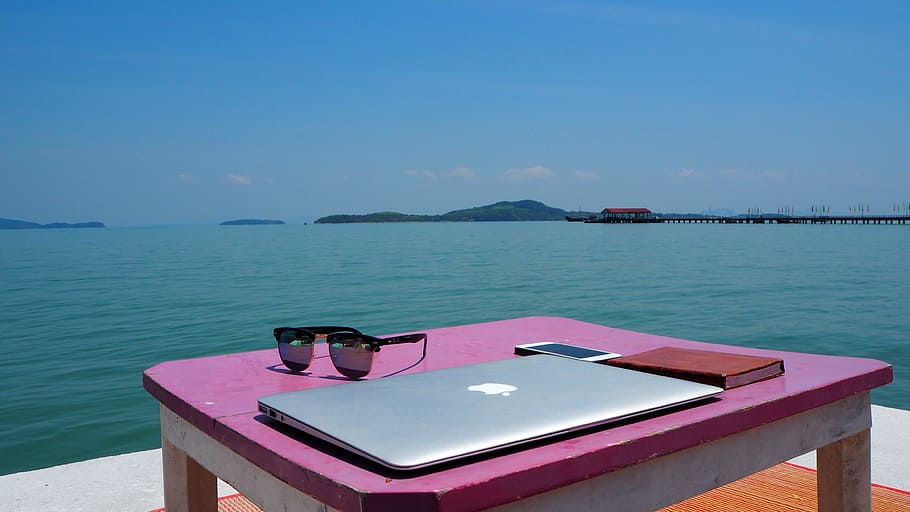 silver macbook, black, sunglasses, smartphone, pink, wooden, table, frame, MacBook Air, desk