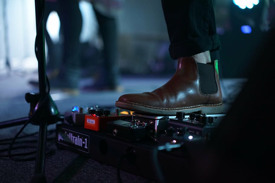 person, wearing, brown, leather chelsea boots, stepping, guitar effects, pedal, chelsea, boot, guy