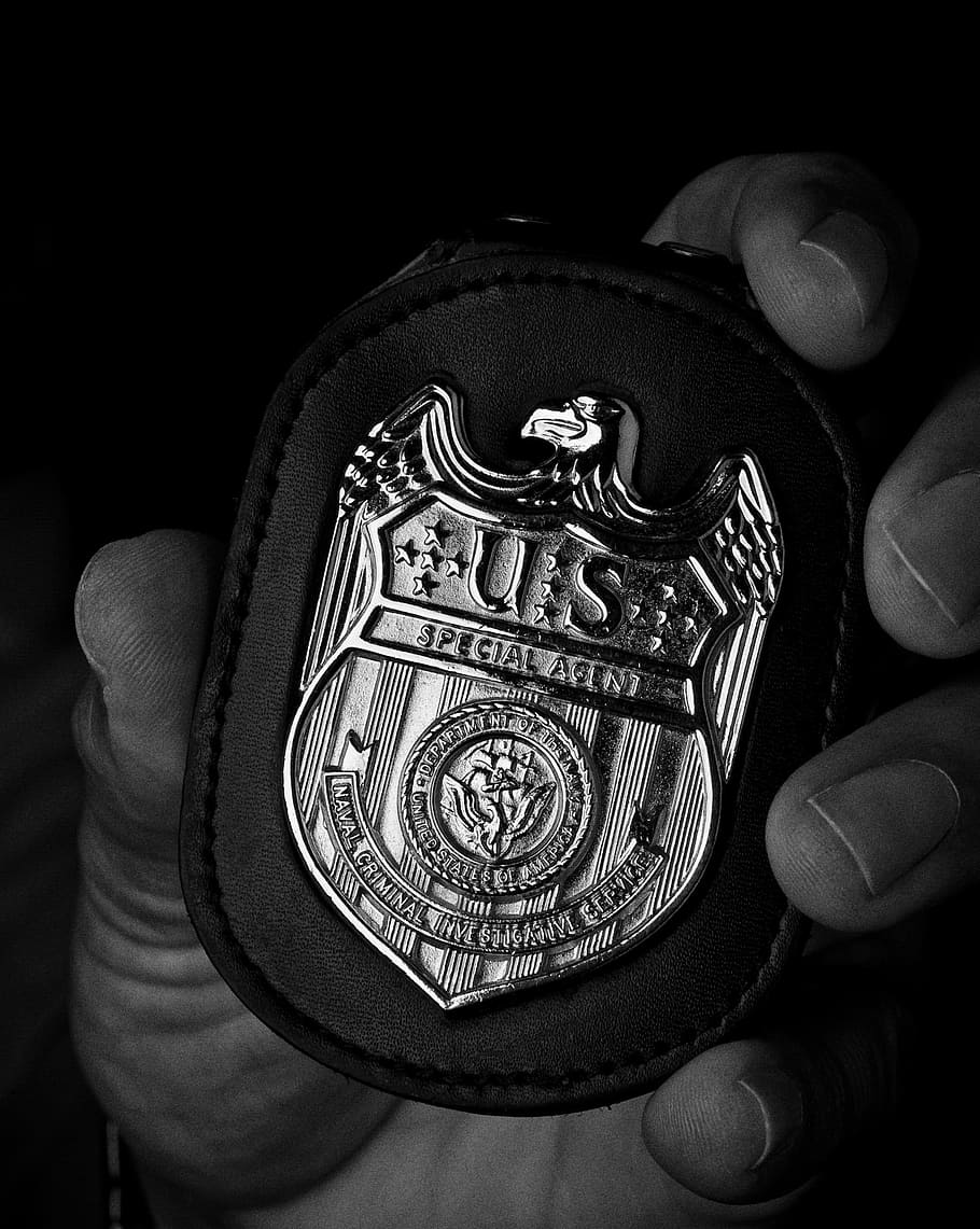 grayscale photo, left, holding, police badge, Ncis, Badge, Hand, Macro, Close-Up, investigative service