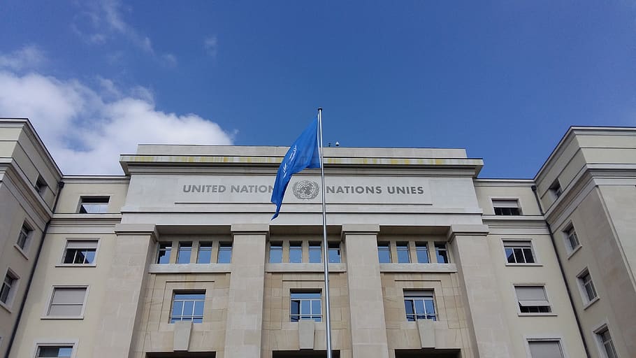 un, united nations, geneva, built structure, building exterior, architecture, sky, window, low angle view, blue