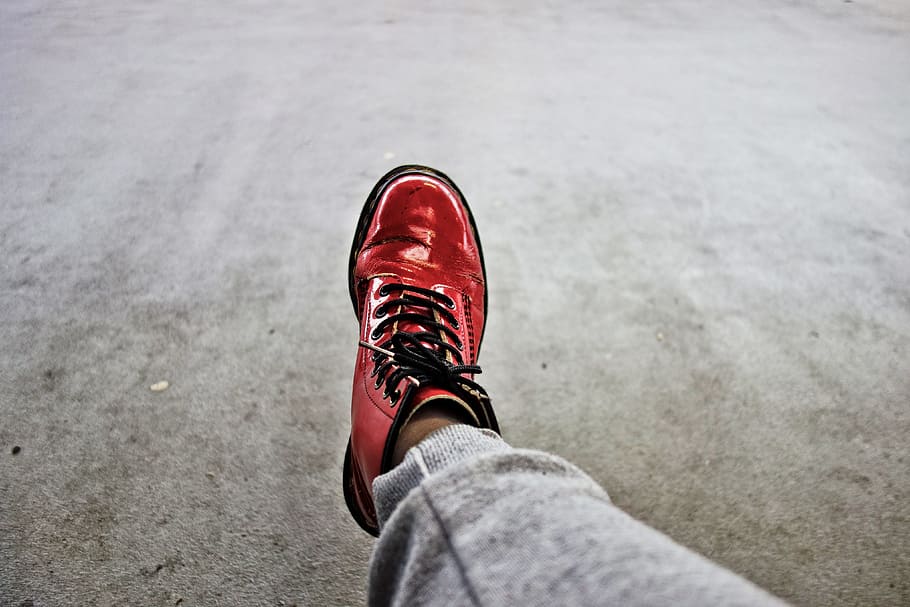 foot, leg, shoe, woman's shoe, doctor martens, red shoe, red docktor martens shoe, red leather, patent leather, patent leather shoe