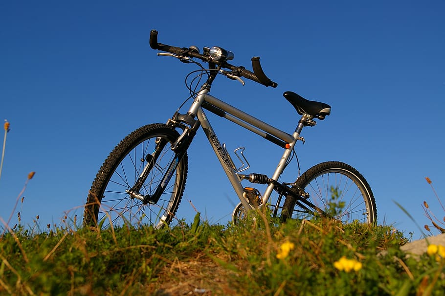 grey, hardtail bike, green, grass field, bike, bicycle tour, bike ride, cycling, mountain bike, tour