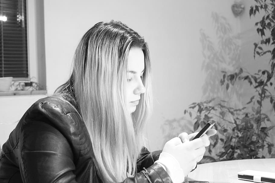 people, woman, blonde, black and white, monochrome, text, cellphone, technology, phone, one person