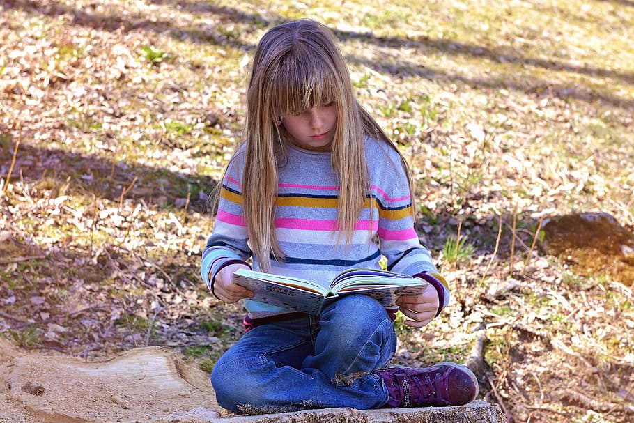 girl reading book, sitting, green, grass, daytime, human, child, girl, book, read