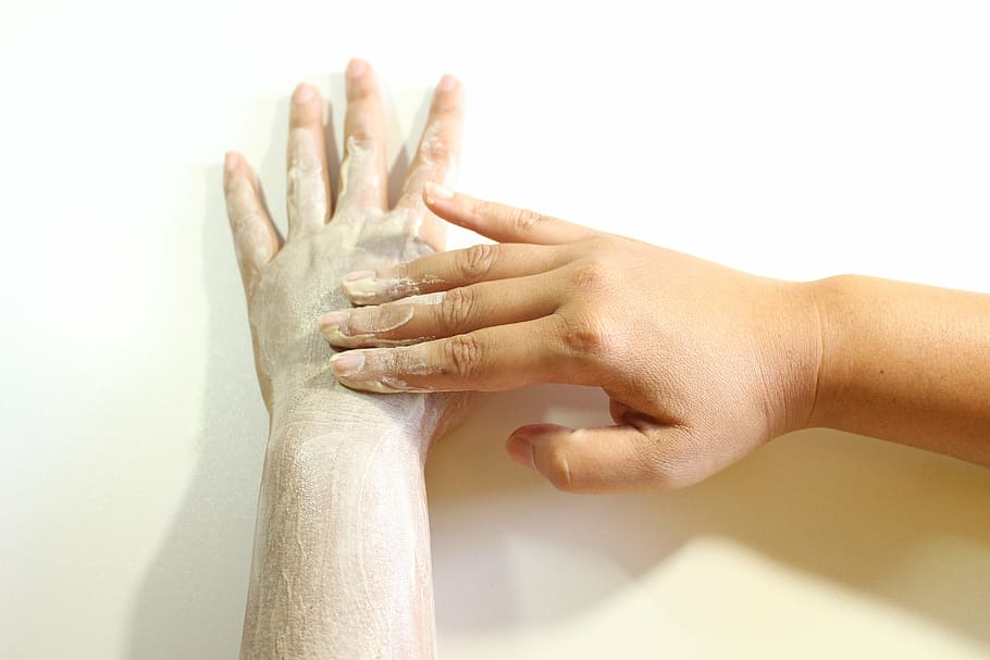 person, applying, white, cream, left, hand, body scrub, scrub, hand scrub, scrub natural