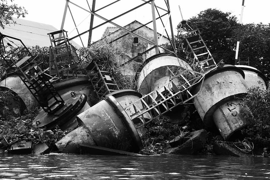 grayscale photo, tanks, junk, metal pile, scrap, waste, garbage, recycle, recycling, heap