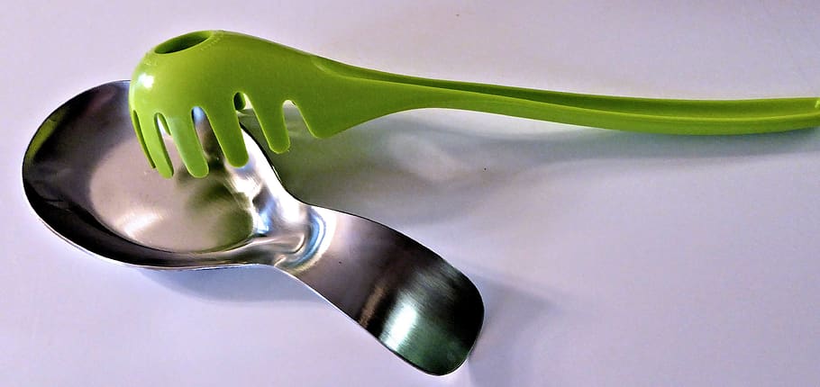 stainless spoon rest, green spaghetti utensil, kitchen, kitchen utensil, eating utensil, studio shot, household equipment, spoon, food, food and drink