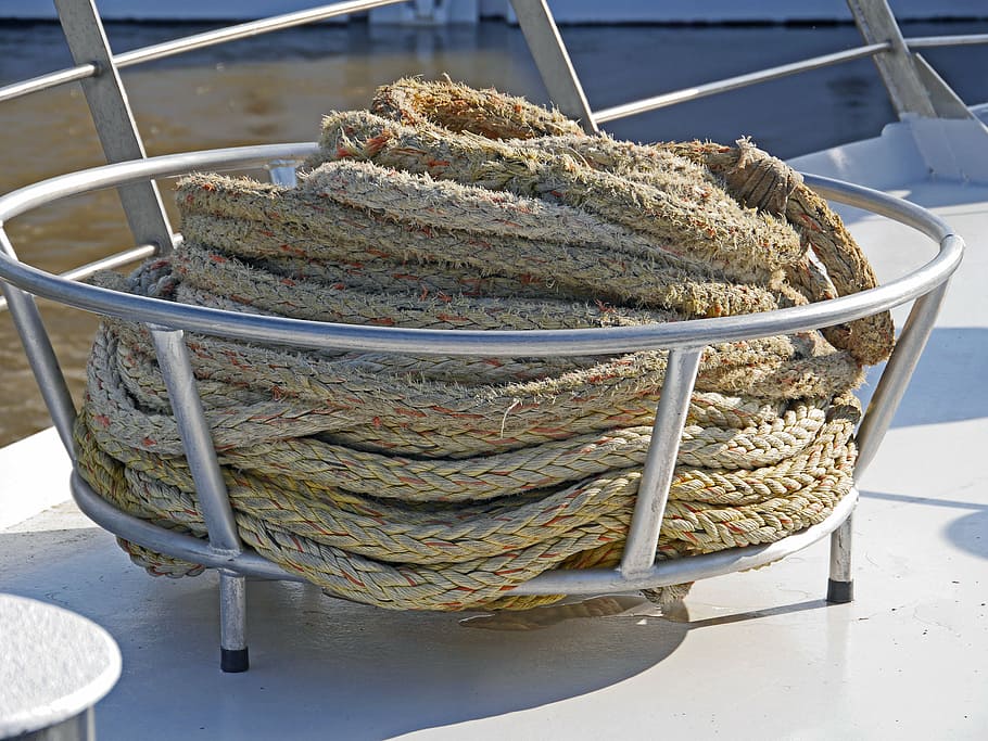 ship traffic jams, barge, front deck, railing, basket, dew, river ship, nylon rope, close up, twisted ropes