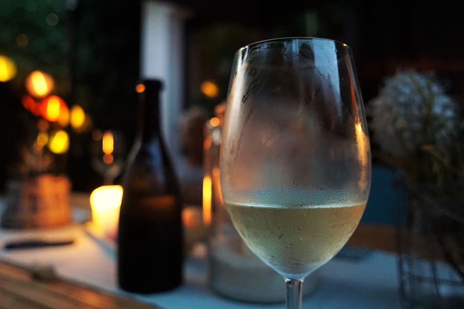 close-up photo, clear, wine glass, wine, candles, mood, wine tasting, table, romantic, drink
