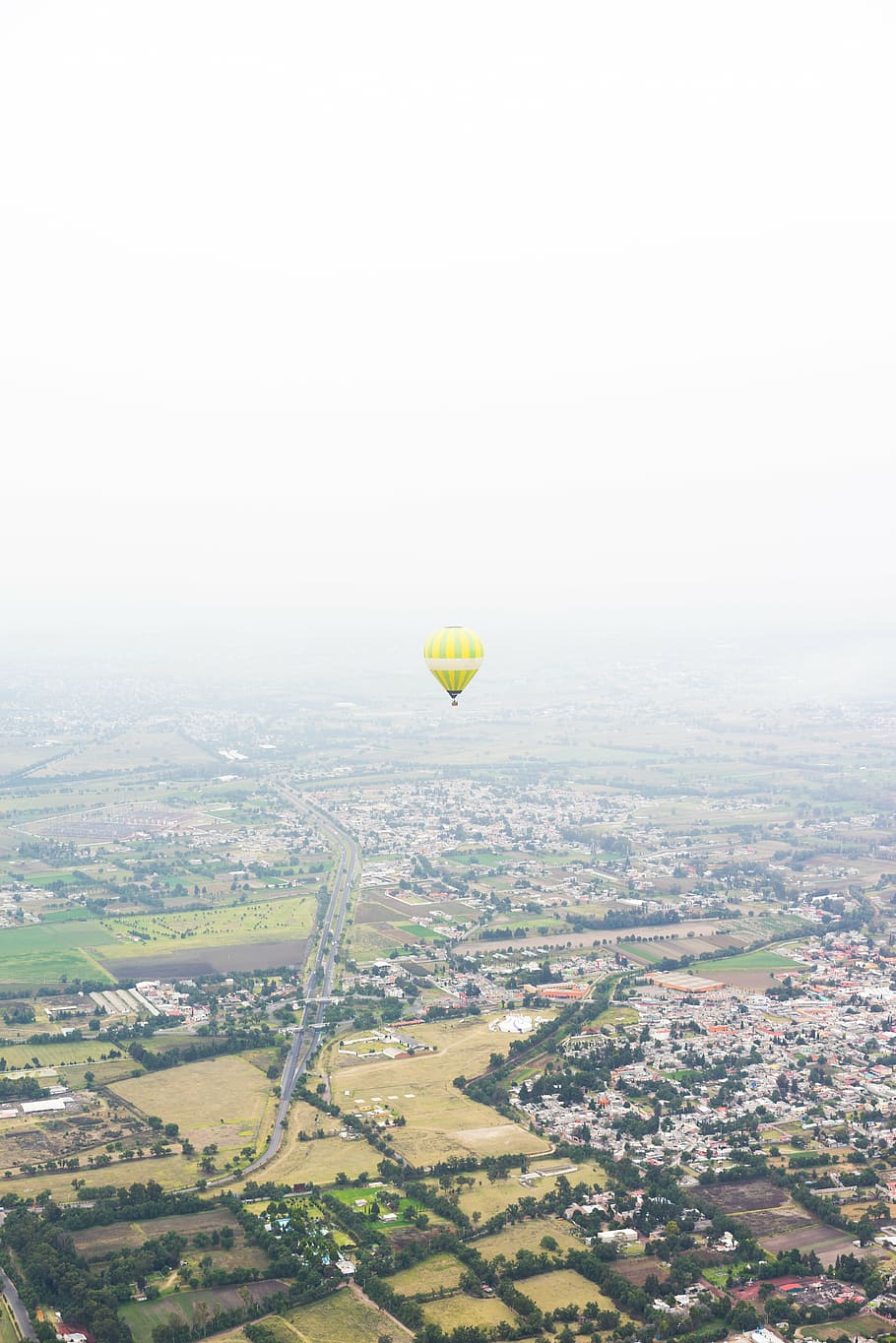 green, hot, air balloon, floating, houses, field, daytime, balloon, land, aerial