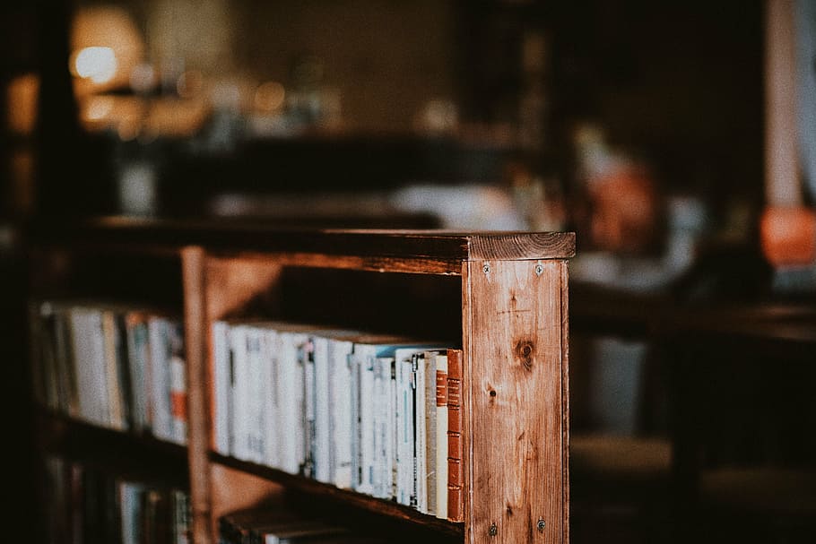 brown, wooden, bookcase, arranged, books, selective, focus photography, shelf, book, collection
