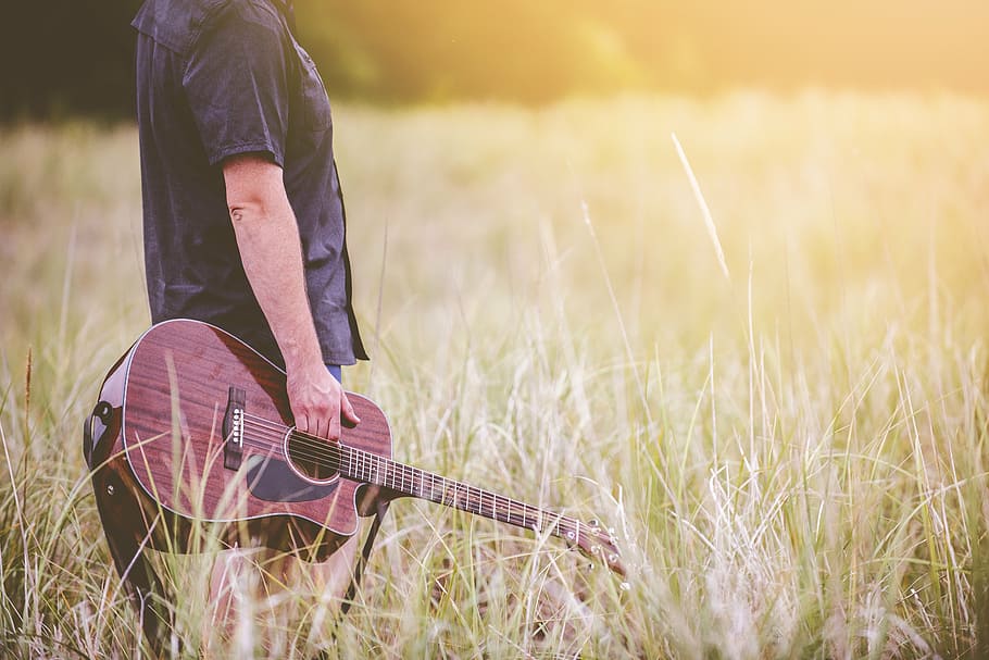 man, holding, acoustic, guitar, grass, human, black, shirt, brown, land