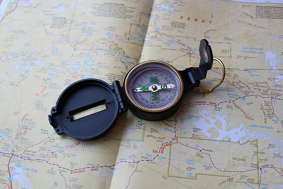 compass on map, compass, map, navigation, guidance, direction, world map, exploration, travel, navigational compass