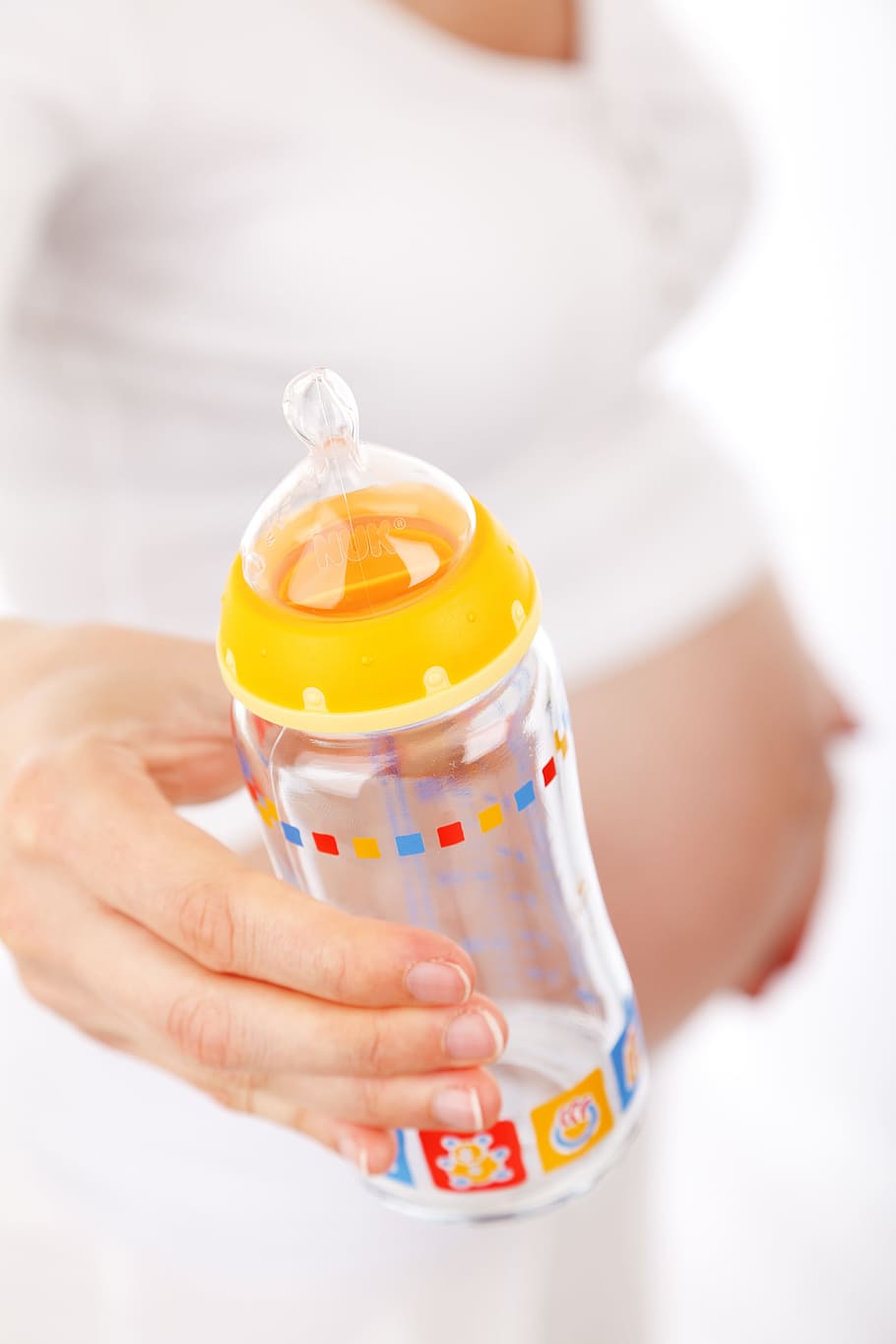 shallow, focus, yellow, feeding, bottle, belly, care, girl, hand, holding