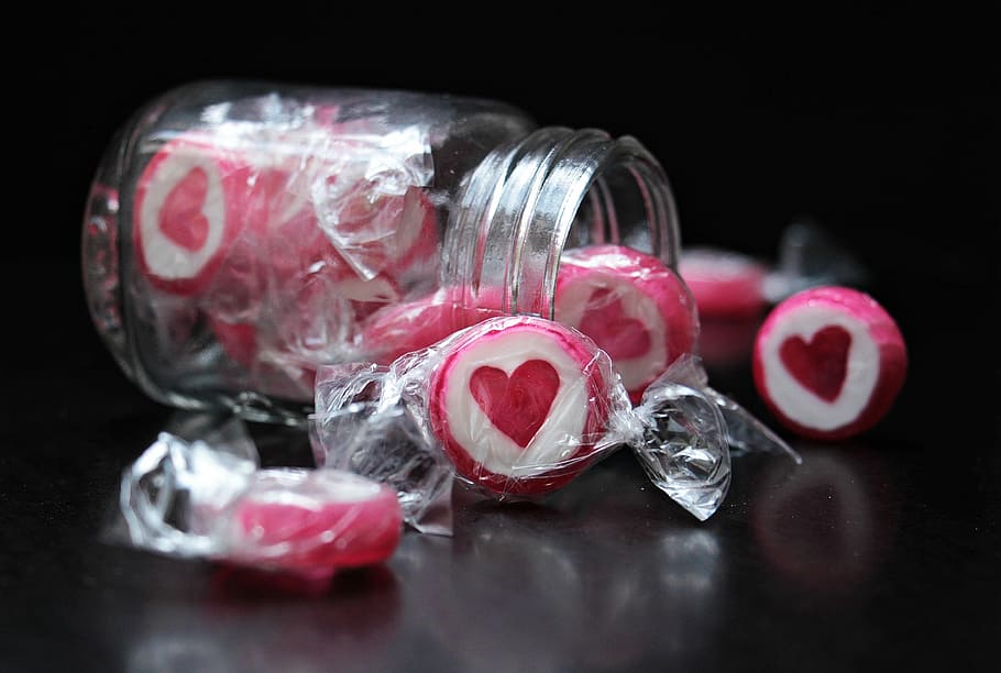 person, taking, white-and-pink candies, jar, candy, heart, heart candy, delicious, treat, hand made sweets