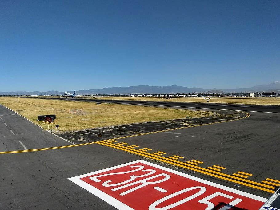 airport, runway, aircraft, aviation, airline, plane, takeoff, sign, sky, road