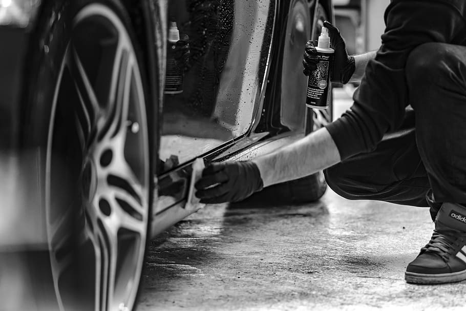 grayscale photography, man cleaning side skirts, car, grayscale, photography, man, skirts, cleaning, steam, smoke
