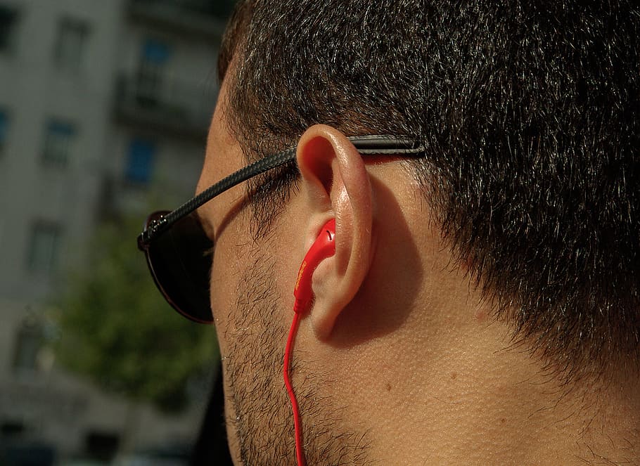 man wearing earphones, headphones, ear, music, sounds, one person, glasses, real people, human face, headshot