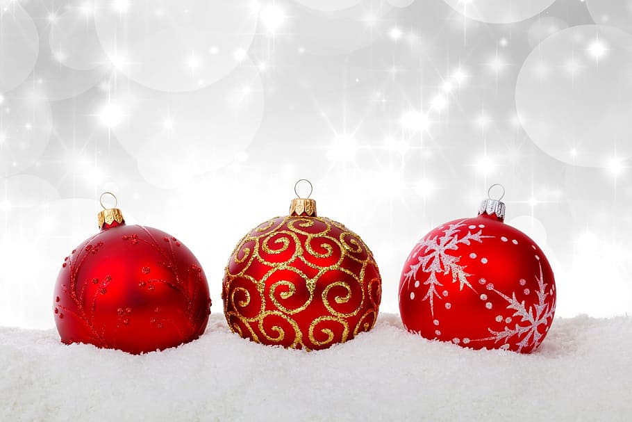 selective, color photography, three, red, glitter baubles, snow surface, lighted, background, white, bauble