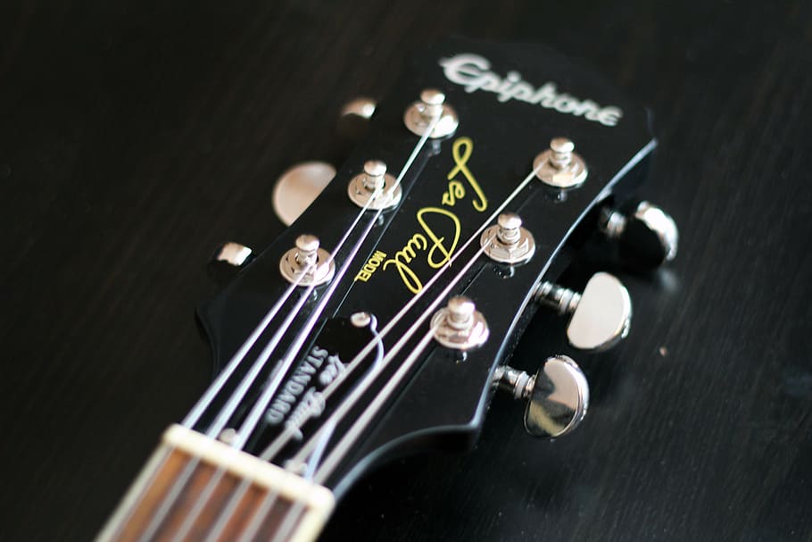 close-up photography, black, gray, epiphone guitar headstock, wooden, surface, epiphone, guitar, les, paul