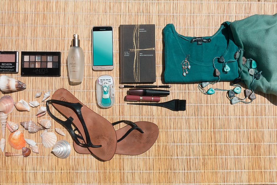 pair, black, leather sling-back sandals, sandals;, android smartphone, smartphone;, makeup palette, palette;, seashells, brown
