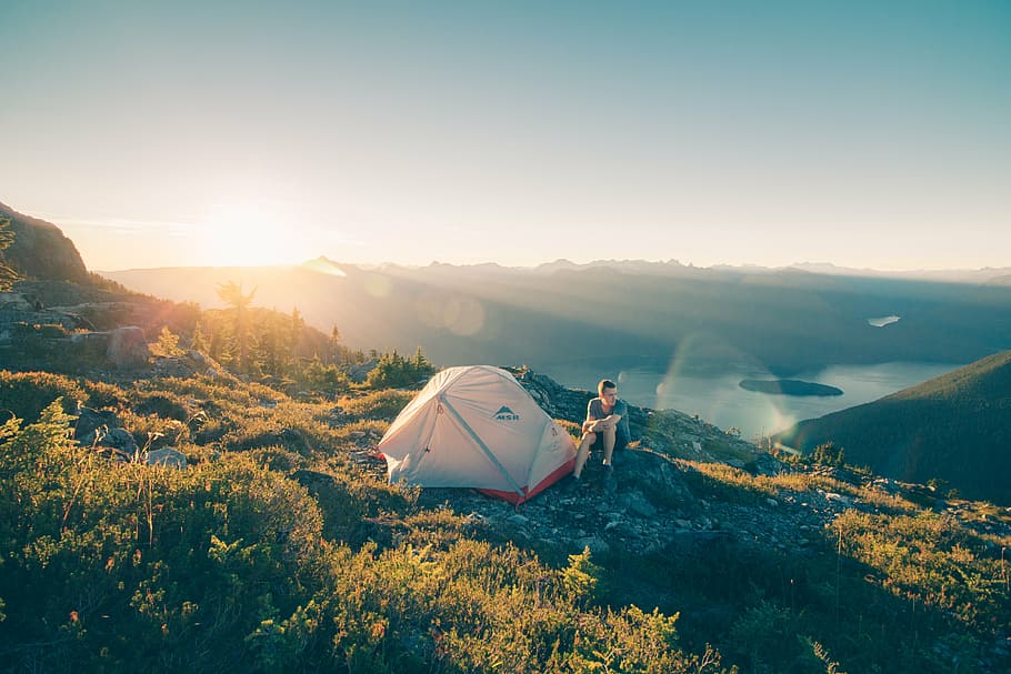 person, sitting, tent, top, mountain, highland, cloud, sky, summit, ridge