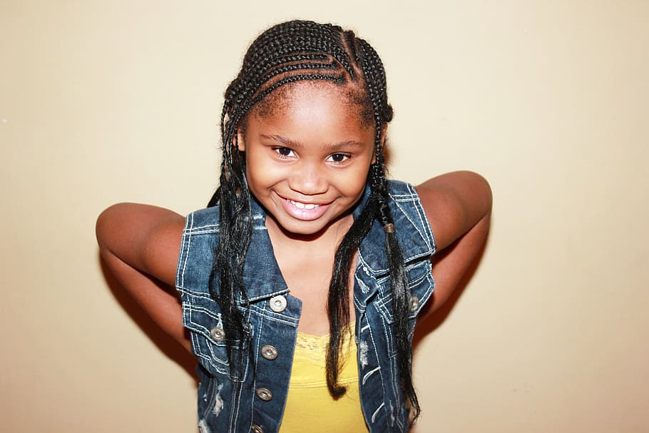 girl, blue, denim button-up vest, child with braids, braids, african american girl, black little girl, happy, smiling, smile