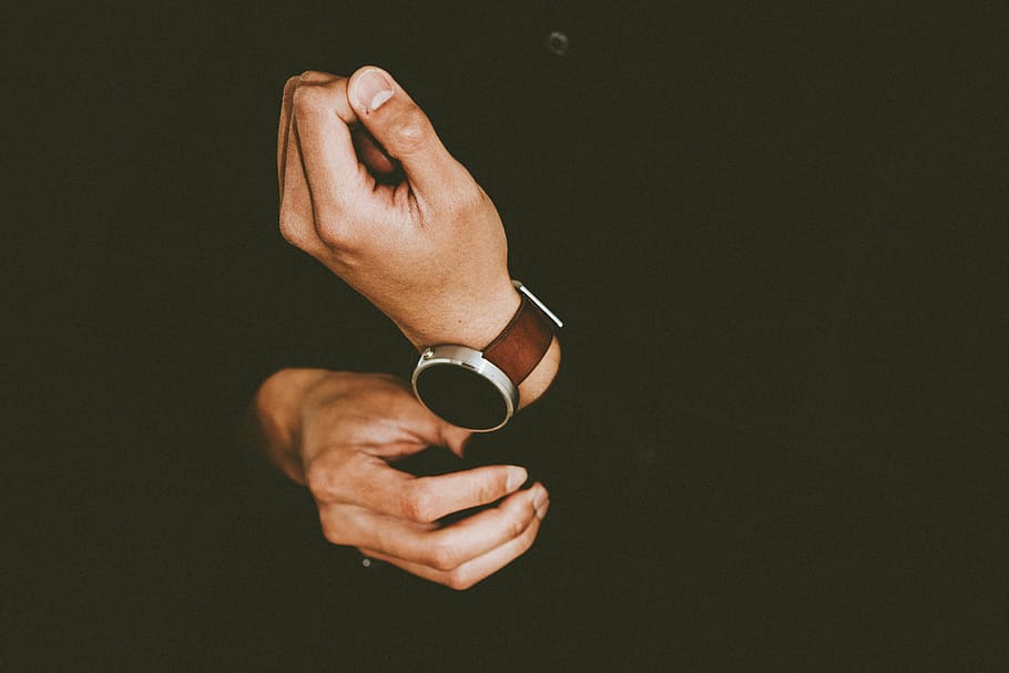 person wearing smartwatch, man, wearing, black, long, sleeve, shirt, brown, strap, watch
