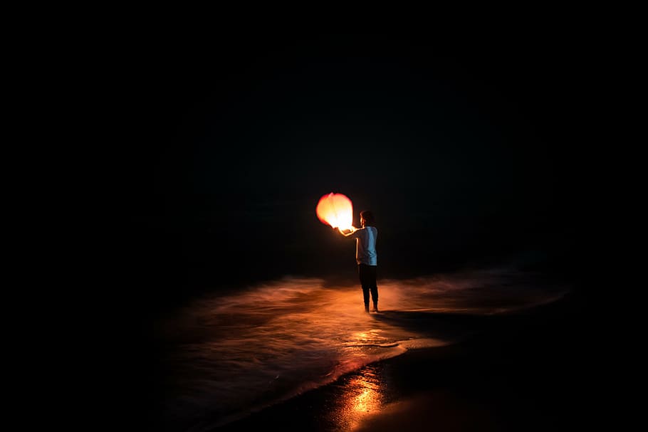 person, holding, paper lantern, black, background, lantern, night, dark, light, balloon