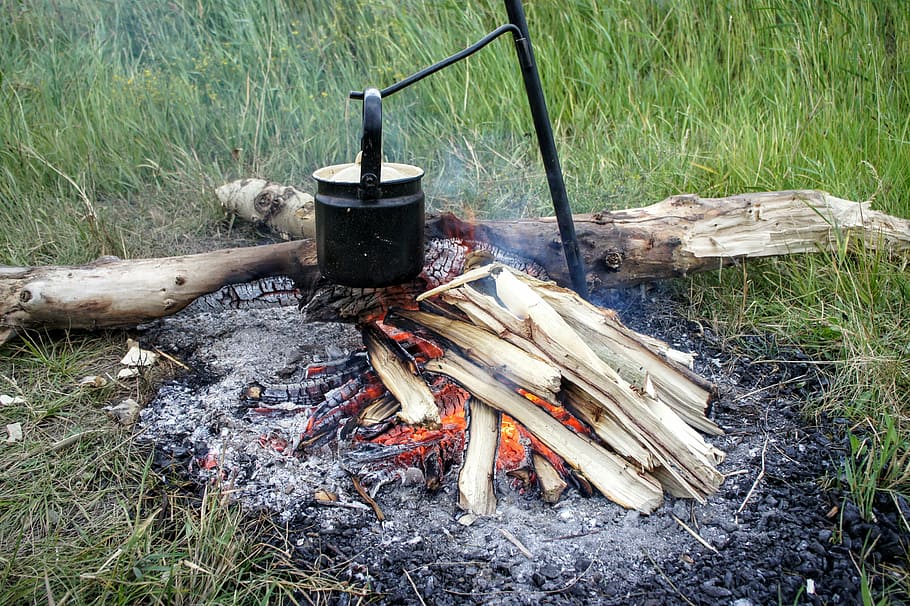 cooking pot, metal rod, wood log, fireplace, wood, fire, boil water, cook, flame, heat