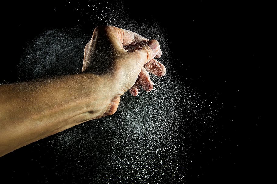 person's left hand, flour dust, flour, hand, baker, food, movement, powder, black background, studio shot