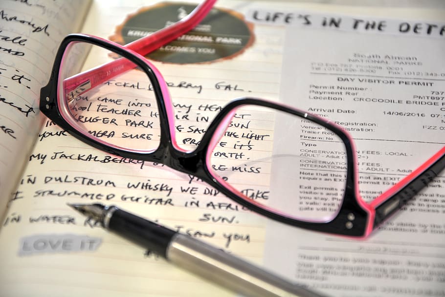 visual diary, writing down, keep record, paper, eyeglasses, glasses, close-up, text, indoors, still life