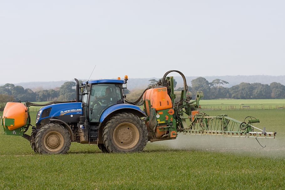blue, yellow, tractor, grass field, spraying, crop spraying, crops, farmland, farm, close-up