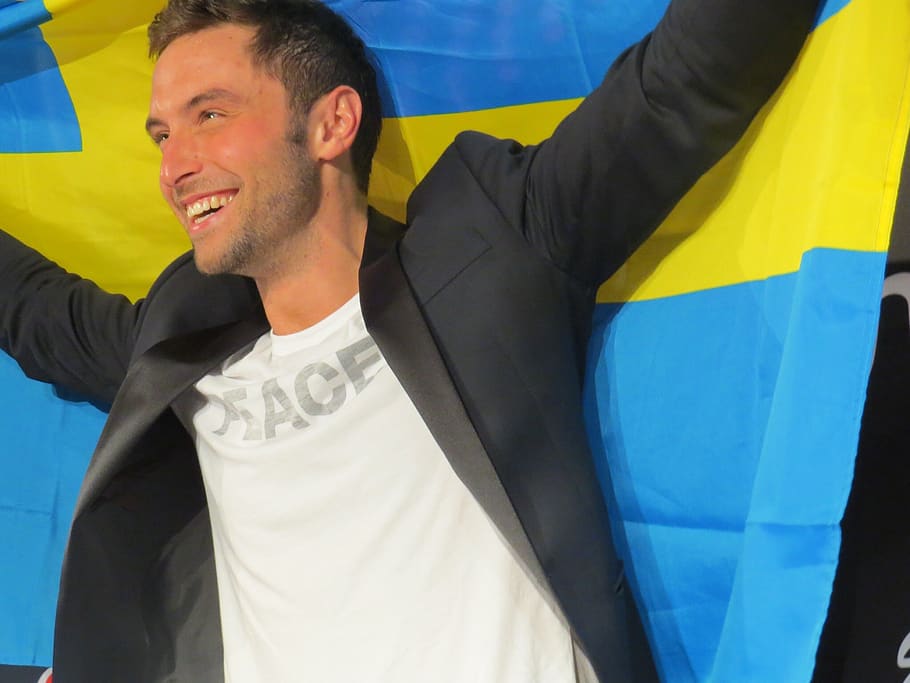 zelmerlof, eurovision sweden, winner of eurovision, song contest 2015, happiness, men, smiling, adult, flag, emotion