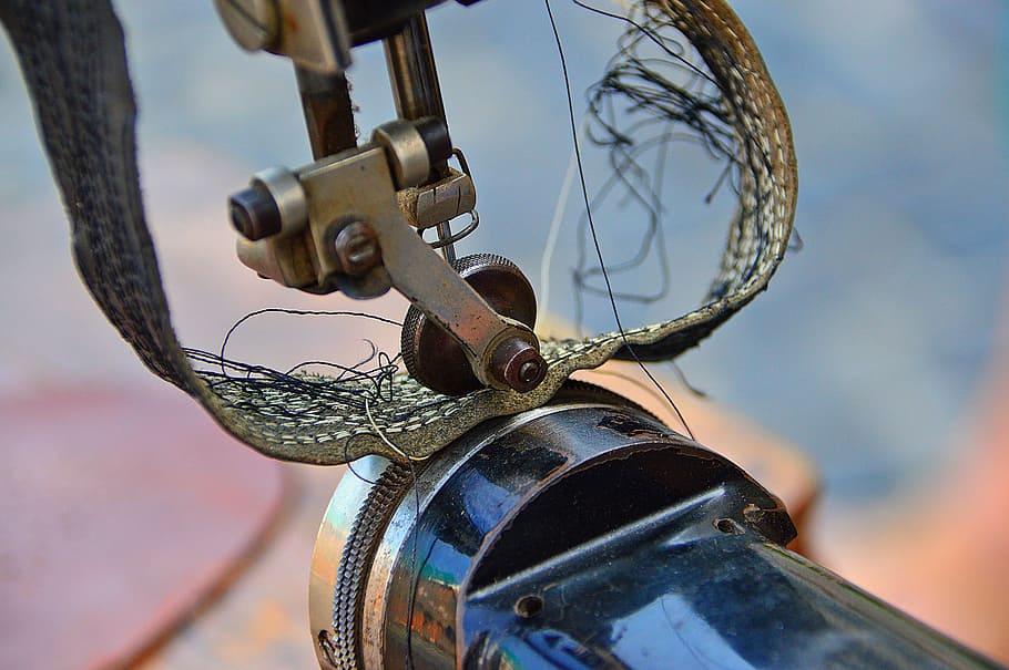 sewing machine, old, veteran, black, sewing, close-up, focus on foreground, metal, bicycle, day