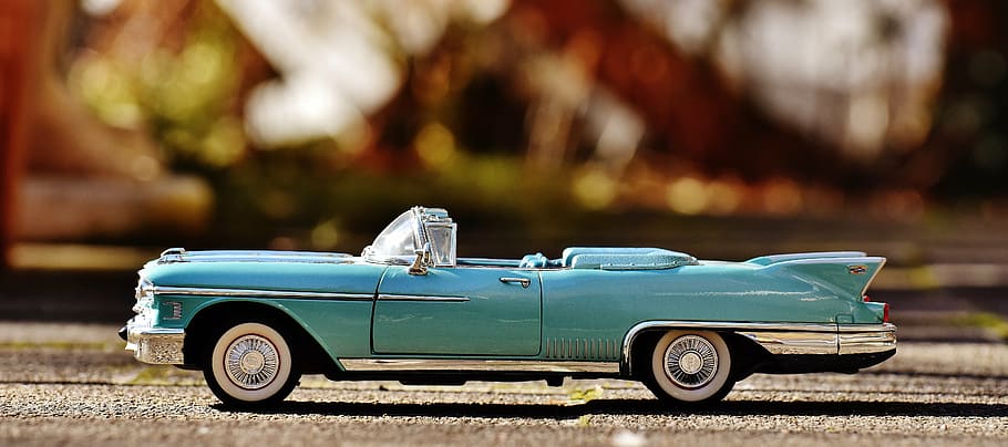 selective, focus photography, teal, convertible, coupe die-cast toy, brown, surface, cadillac, 1958, model car