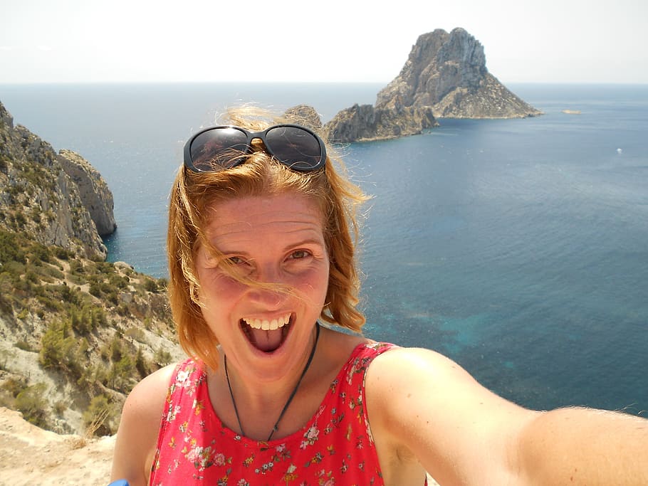 woman taking selfie, Ibiza, Fun, Mountain Top, Island, summer, sea, happiness, rock - object, smiling