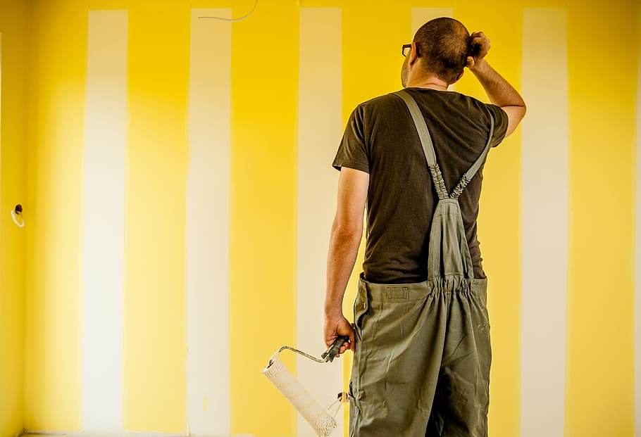 man, wearing, brown, shirt, overalls, holding, paint roller, building, painter, painting