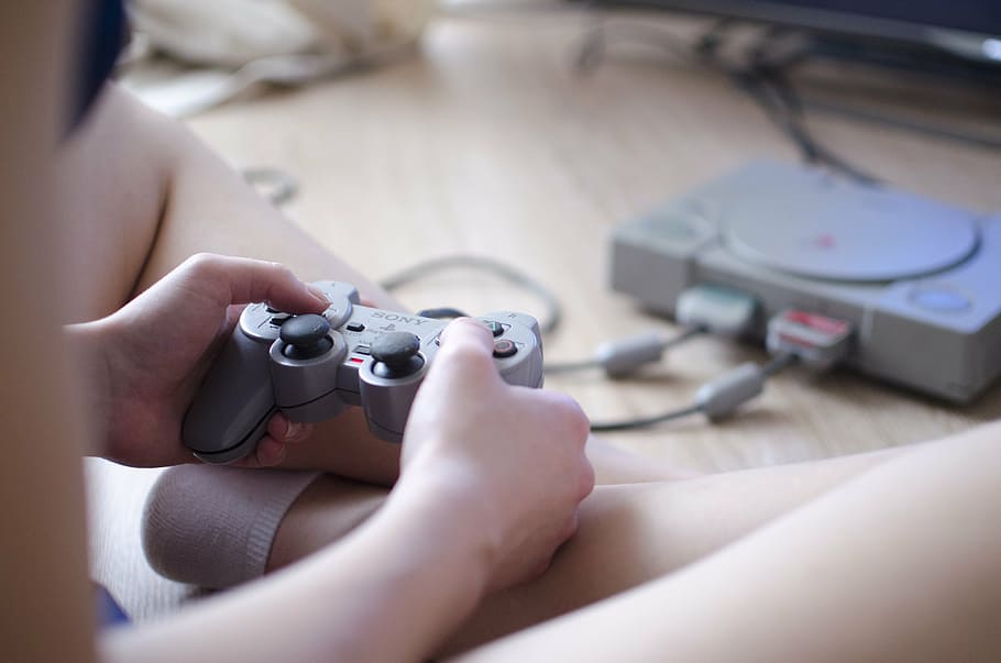 person, holding, sony ps 1 controller, ps1, joystick, video game, girl, television, palystation, sony
