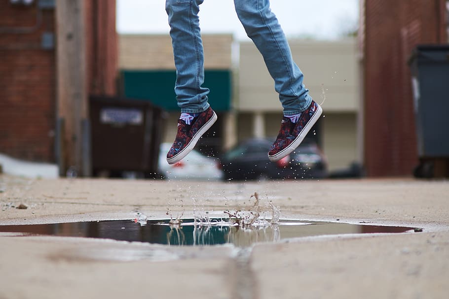 person, wearing, blue, denim, skinny, pants, red, shoes, jumping, beige