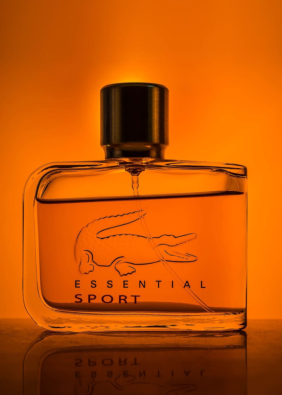lacoste, essential, sport fragrance bottle, bottle, perfume, odor, view, light, orange, yellow