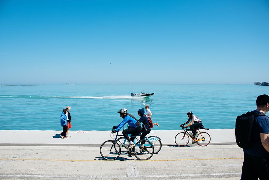 people, walking, biking, body, water, three, riding, bicycles, gray, road