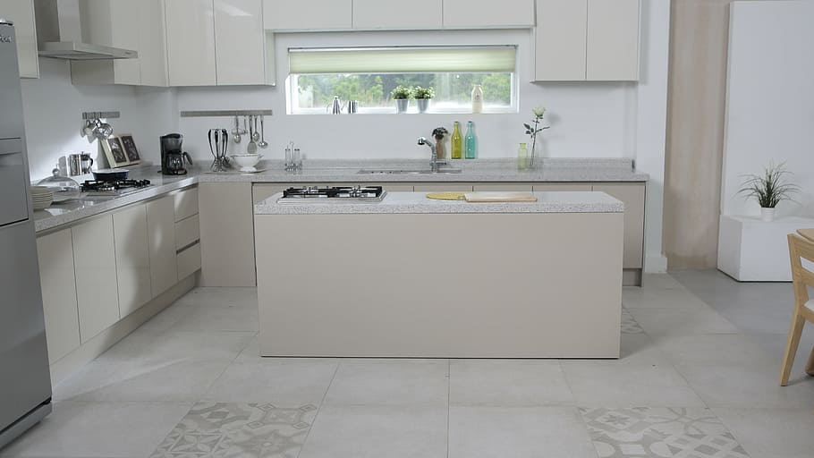white kitchen island, kitchen, dining table, flooring, floor, space, home Interior, domestic Kitchen, modern, indoors