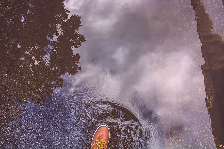 unpaired, brown, leather lace-up dress shoe, stepping, water, puddle, rain, reflection, shoe, waves