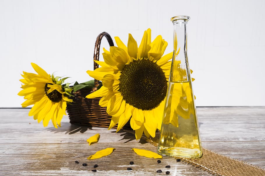yellow, sunflowers, clear, glass flask, brown, wooden, surface, oil, sunflower oil, cooking oil