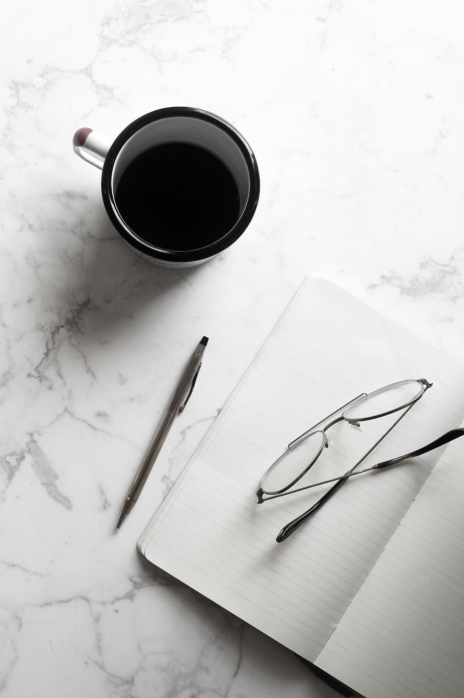 half-empty, black, white, ceramic, mug, notebook, cup, coffee, espresso, pen