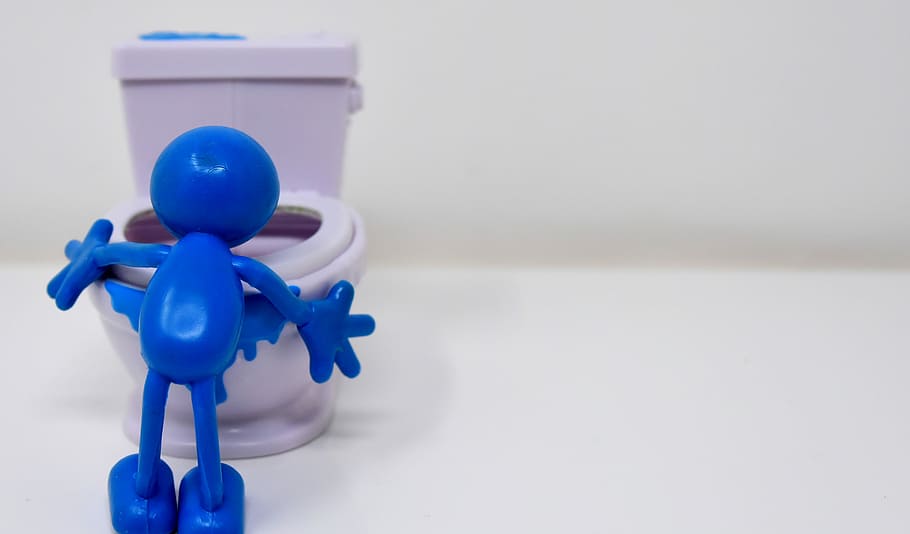 blue, plastic toy, white, ceramic, toilet bowl, loo, toilet, smiley, puke, toilet hug